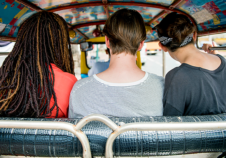 Traveler capturing and creating a travel gemstone with photos and description of a beautiful destination